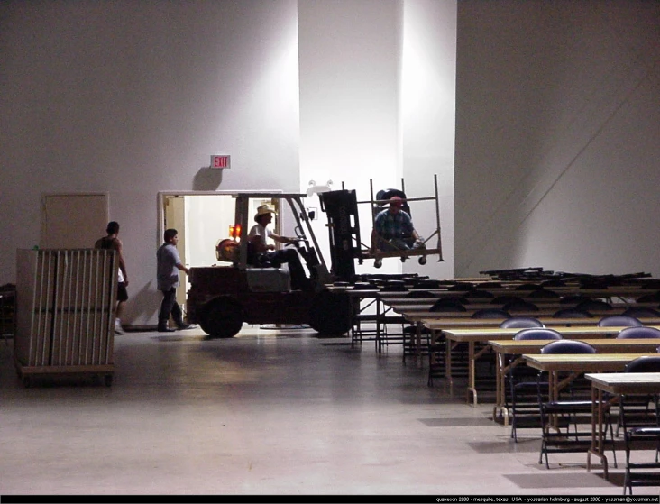 a man in front of some very big tables