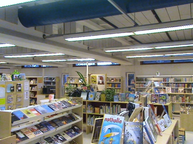 a bookstore filled with lots of books in the middle of it