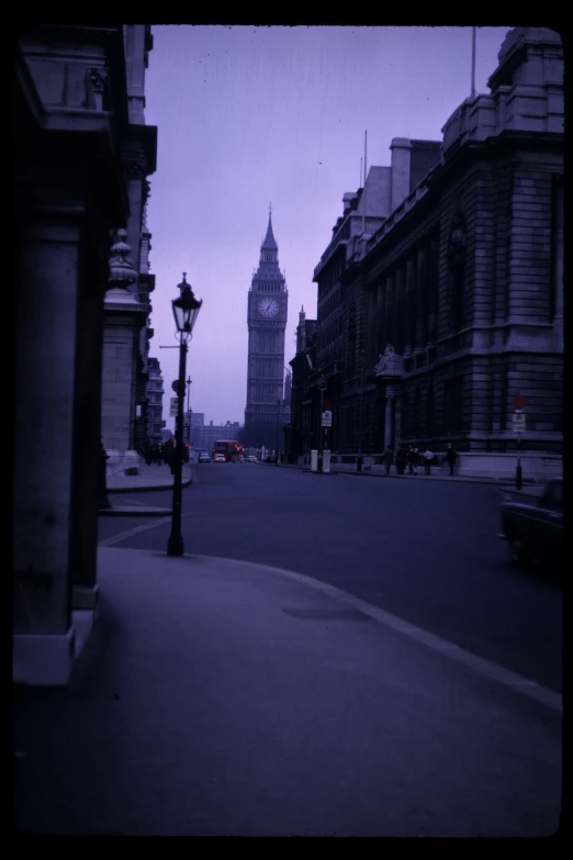 street light with buildings and cars on it