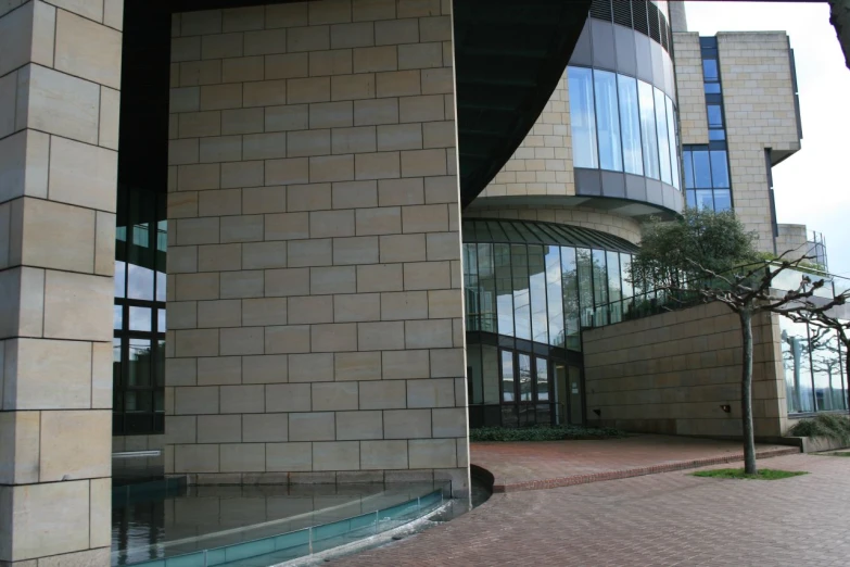 a large building with a glass door and some buildings