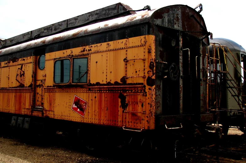 the side of a train car that is rusty