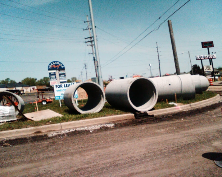 two big pipes on the side of the road