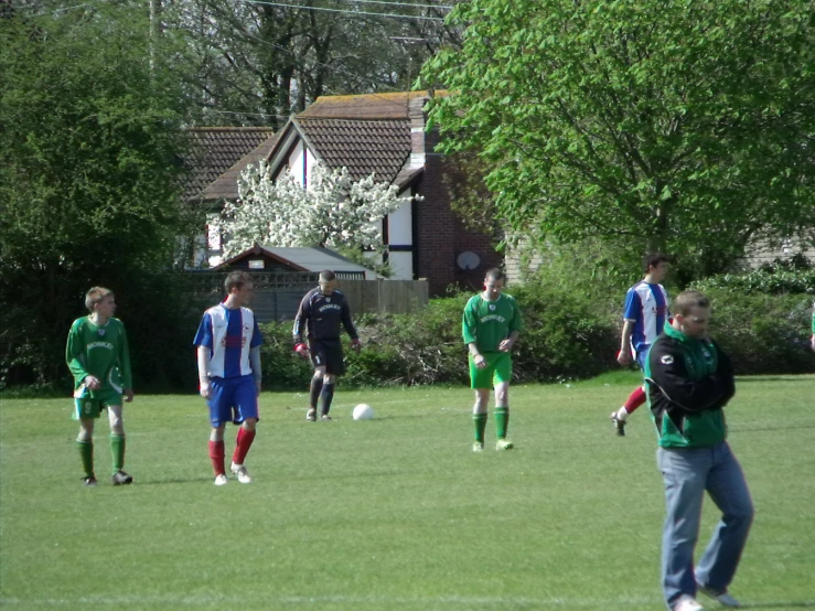 a group of people are playing soccer together