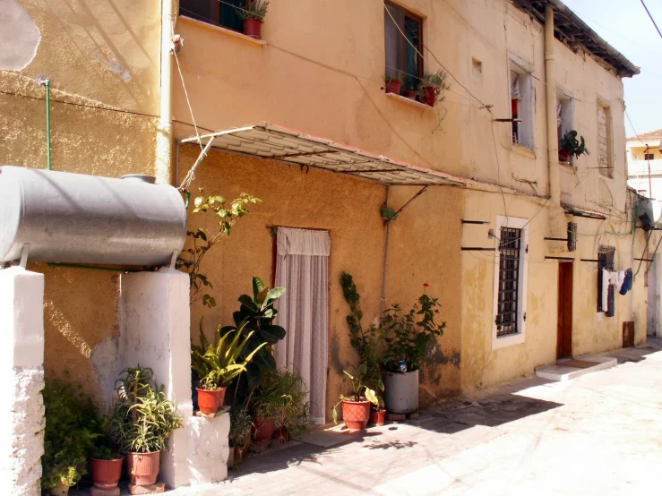 two buildings on a narrow street near one another