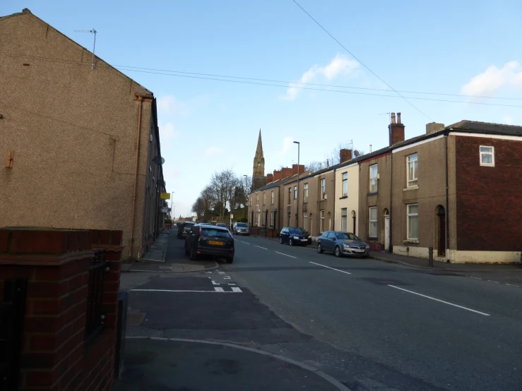 a group of cars on a narrow street