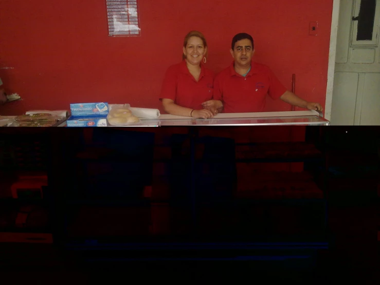 there is an image of two people behind a table