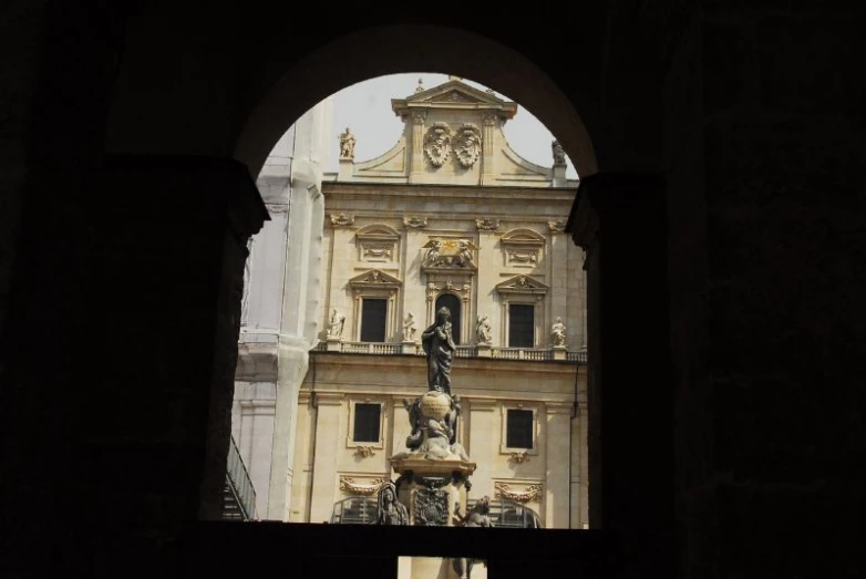 an arched doorway leading to an ornate building