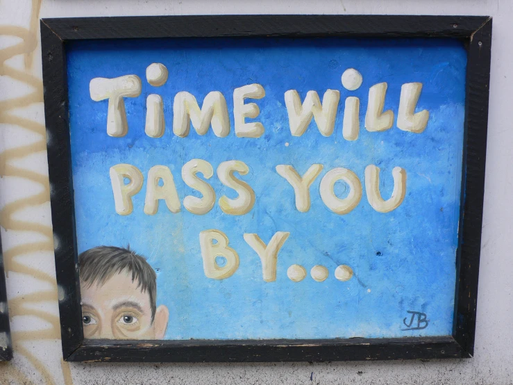 the painted sign says, time will pass you by