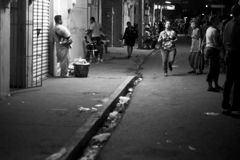 a group of people that are standing on the street