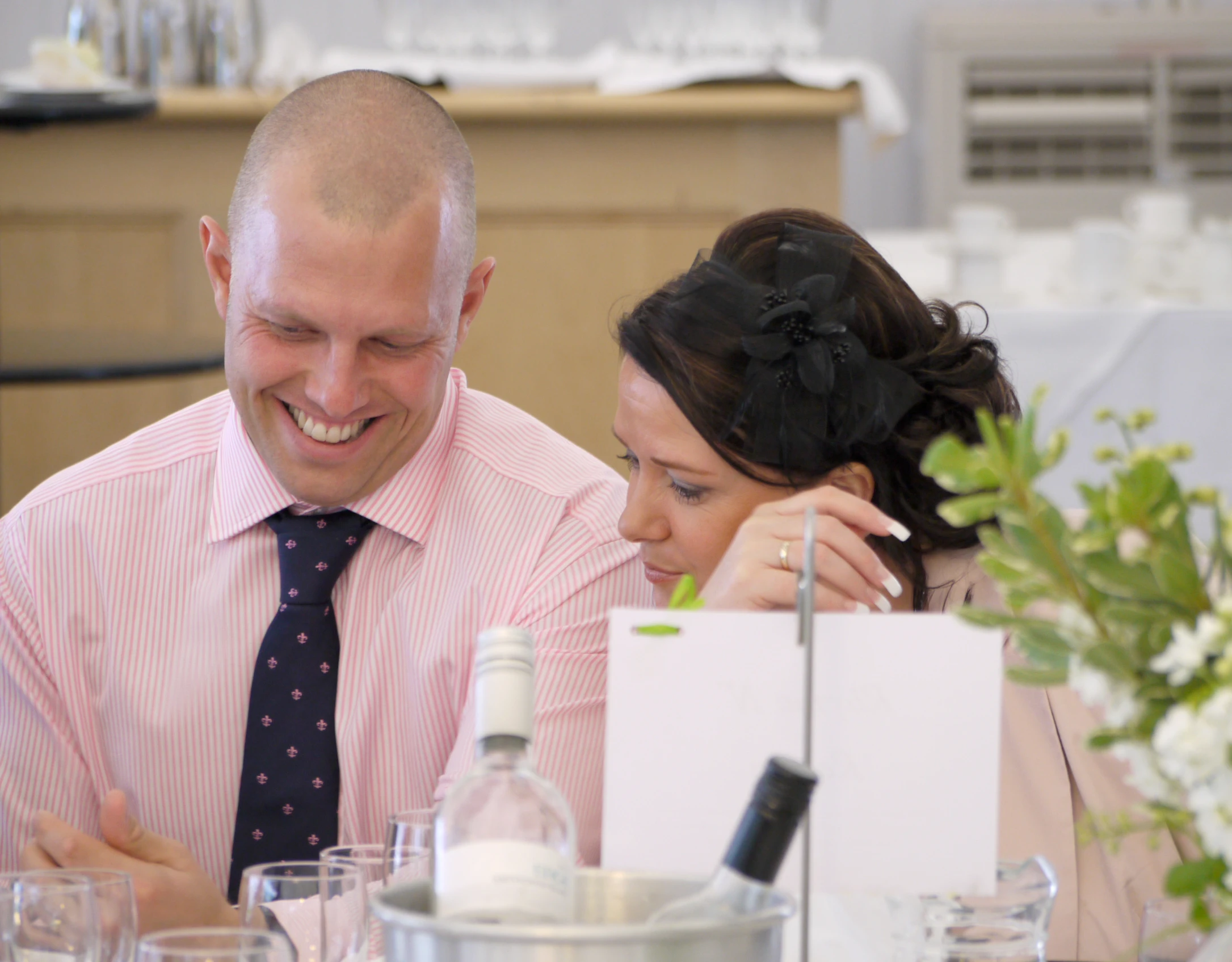 a couple sitting at a table at a restaurant