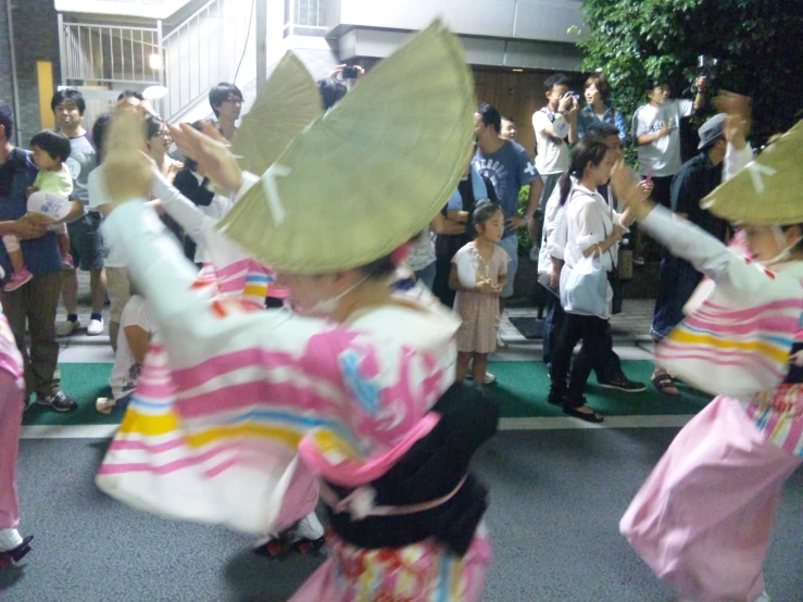 a number of people dressed in costumes dance