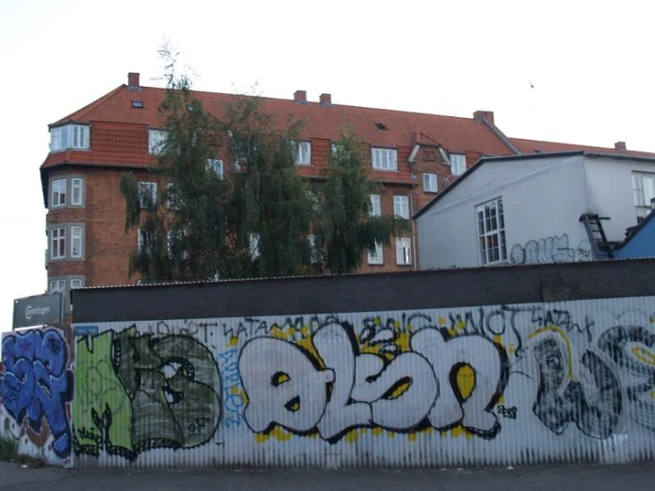 a building with many different pieces of graffiti on it