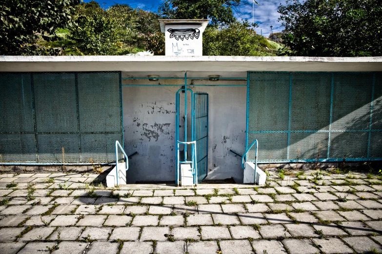 a couple of large gates sitting outside of a building