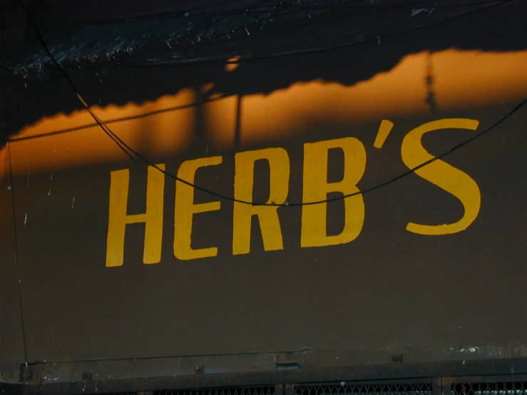 the back side of a restaurant sign for herbs