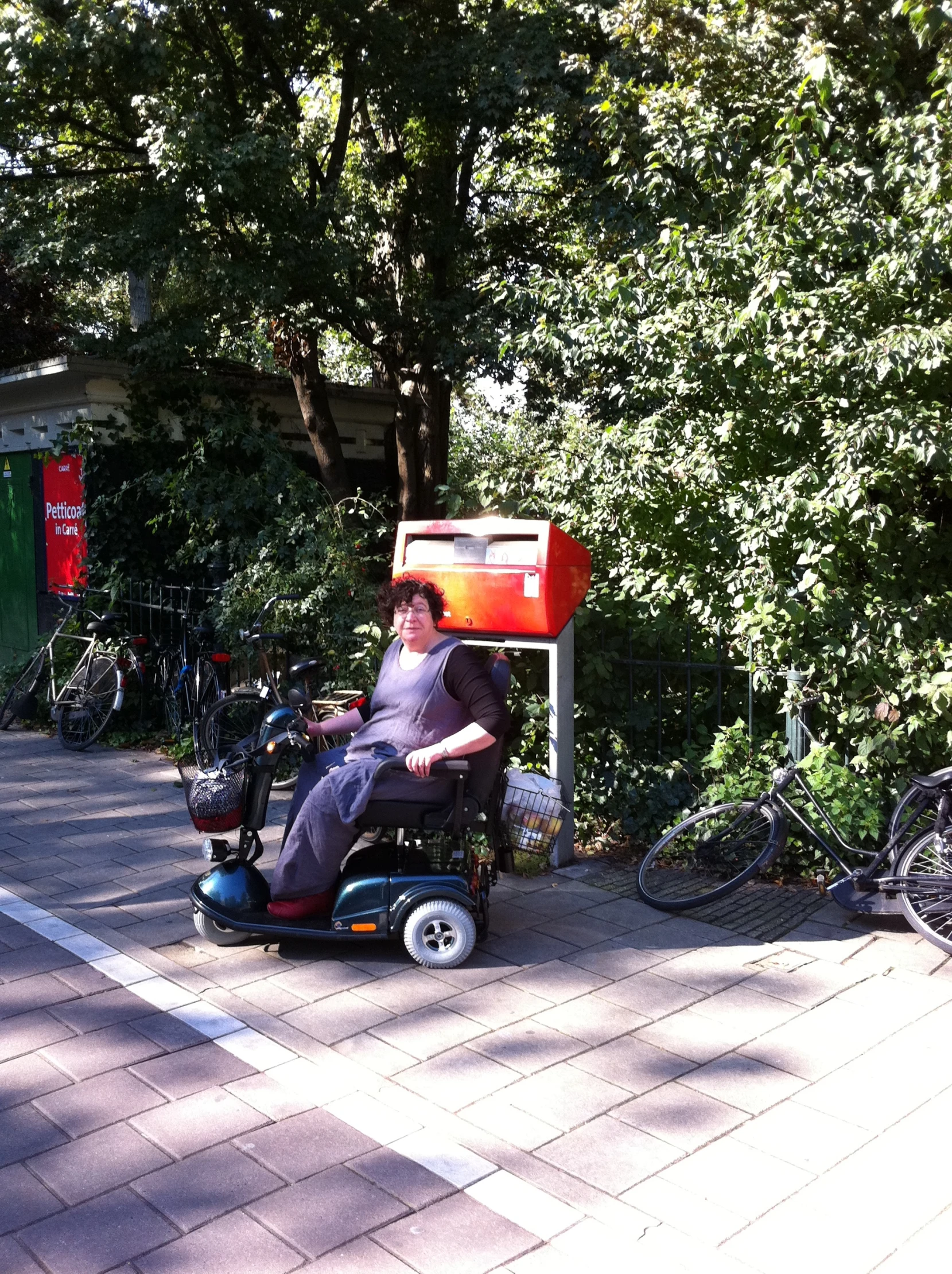 a person that is sitting in a chair with a wheel