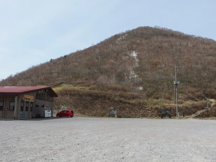 a house in the woods on the side of a mountain