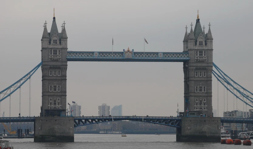 a tall bridge that has people standing on top of it