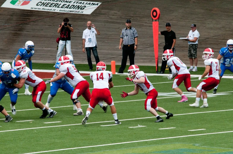 the football players are trying to run for the first down