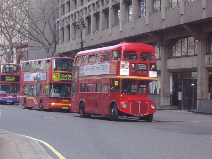 a street that has two double decker buses on it
