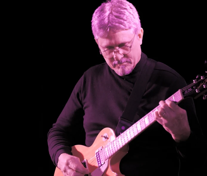 a man that is playing an electric guitar