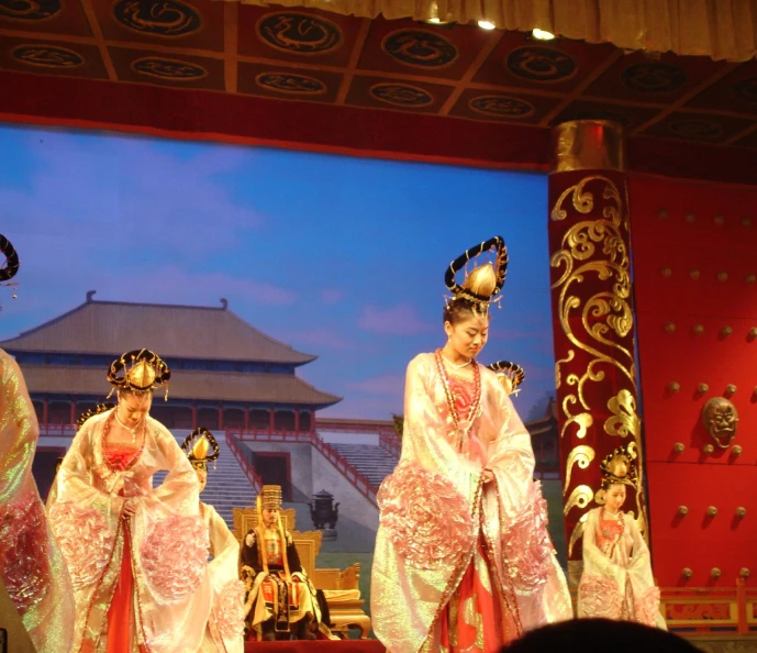 a couple of women in oriental style dress on stage