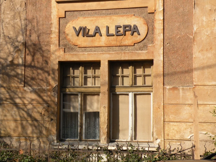 an old house with a window that reads villa lepa