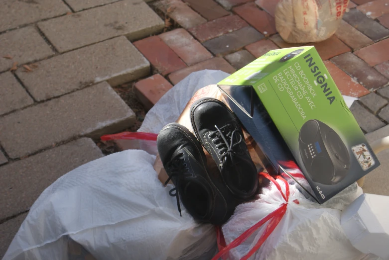 some shoes and a box on a street