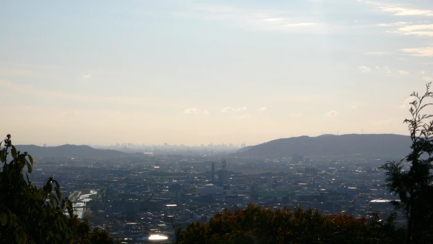 an aerial view of the city from atop a hill