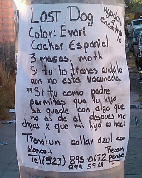 a sign on the pole that has written with spanish words