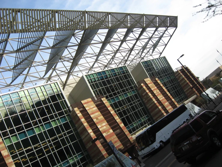 the side of an office building with cars parked by it