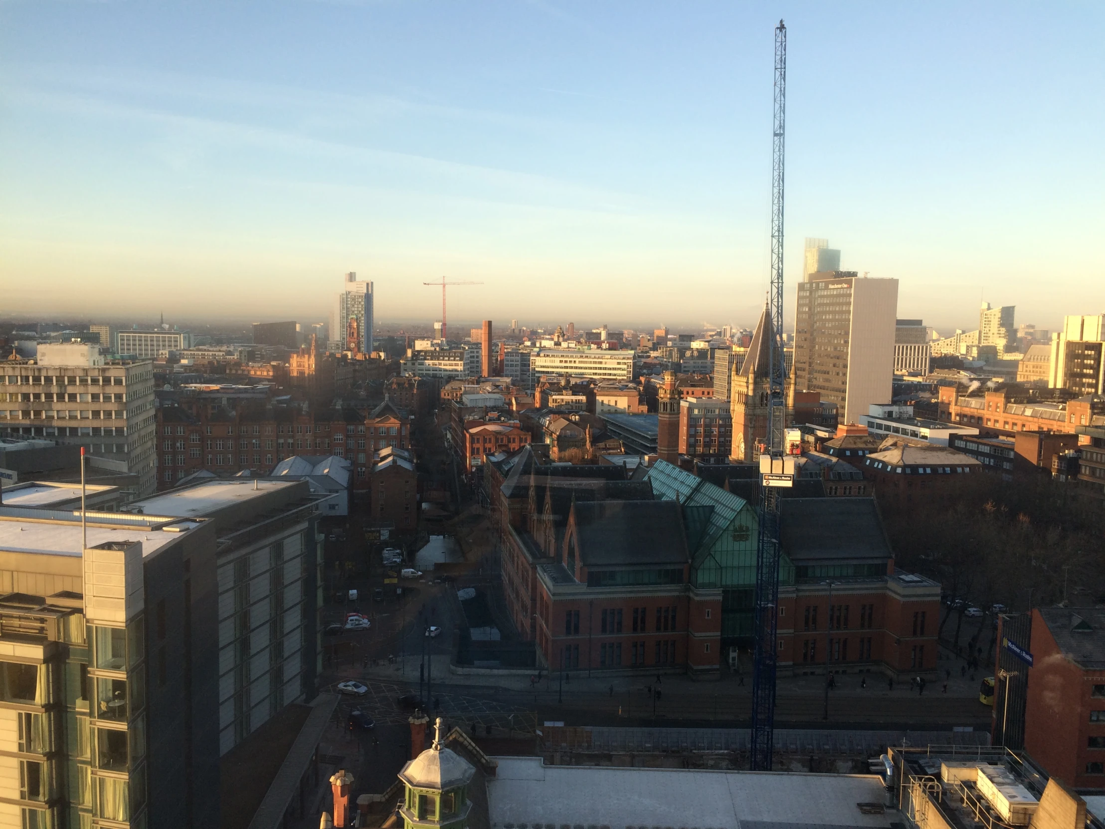 the view from an office building shows a skyline of buildings and tall skyscrs