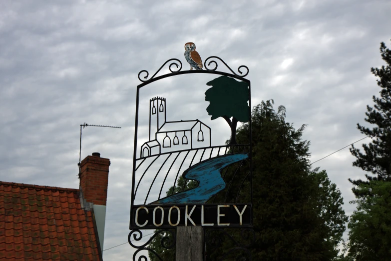 the sign has a picture of a town over it