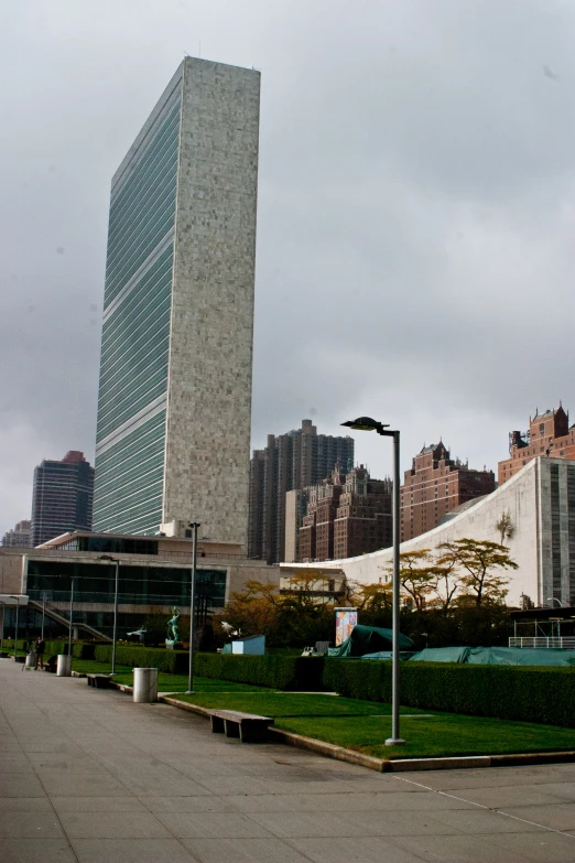 the large building in front of the tall skyscr looks like a work from afar