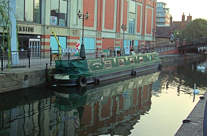 a small barge that is floating down a canal