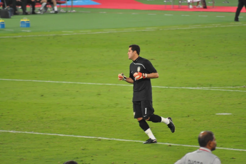 a soccer player is running on the field