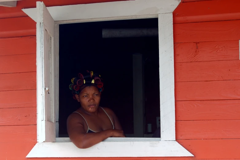 a woman is wearing a flower wreath on her head