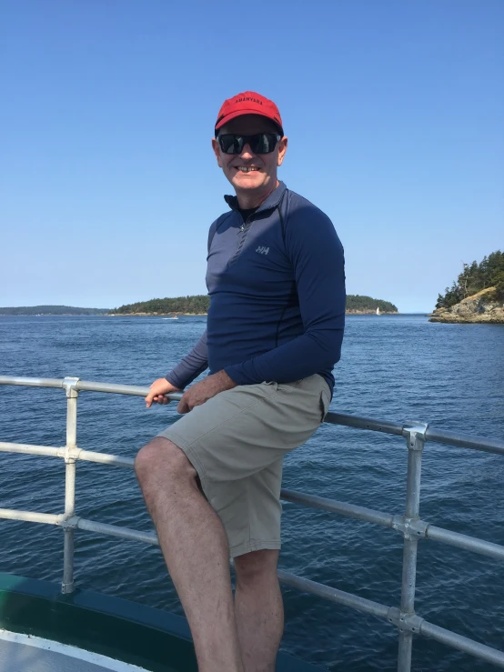 a man sits on the edge of a boat