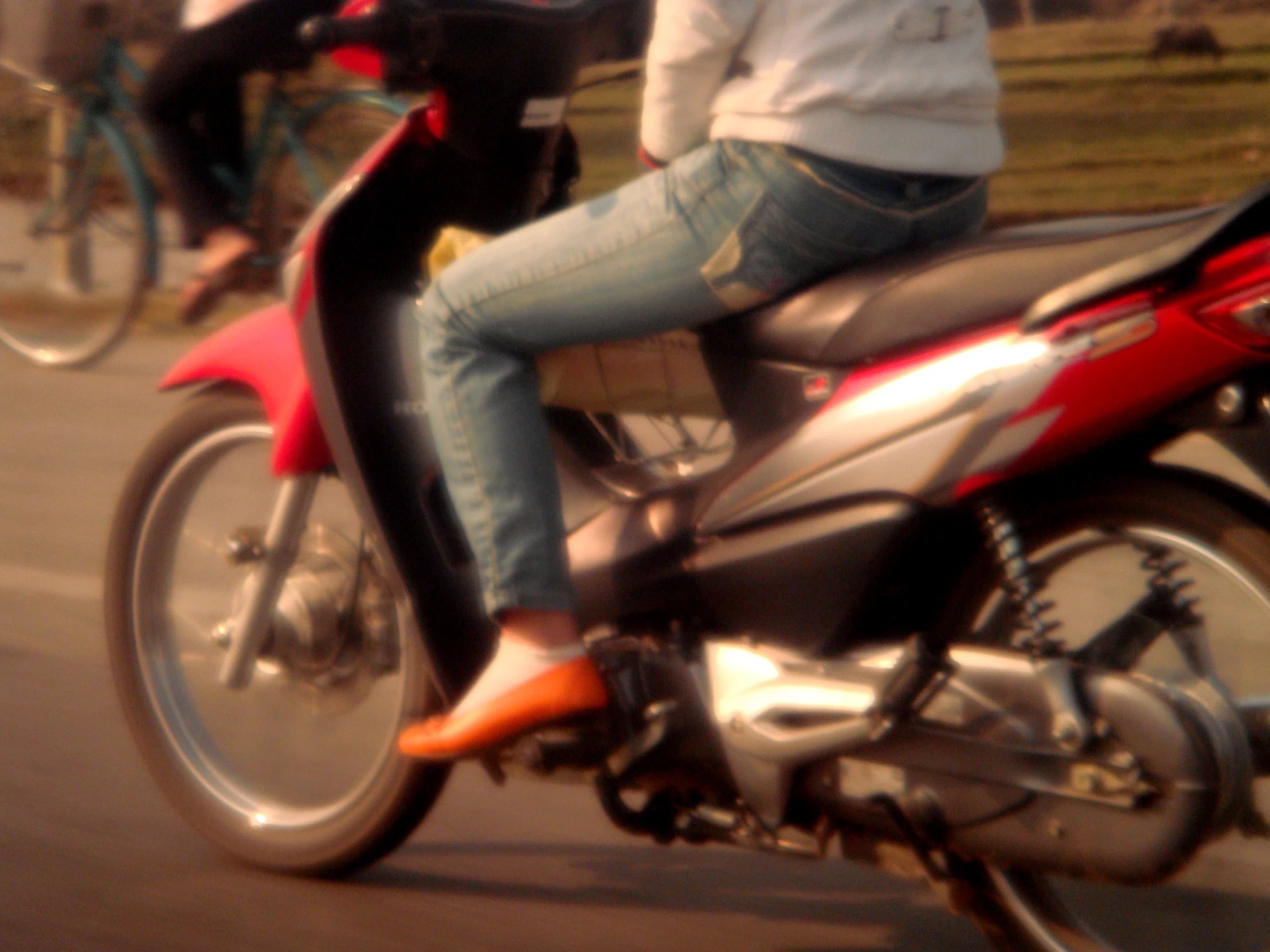 a person riding a scooter on the street