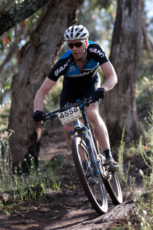 a man riding on the front end of a bicycle