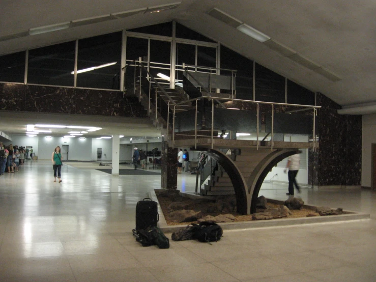 the people are waiting in a subway terminal