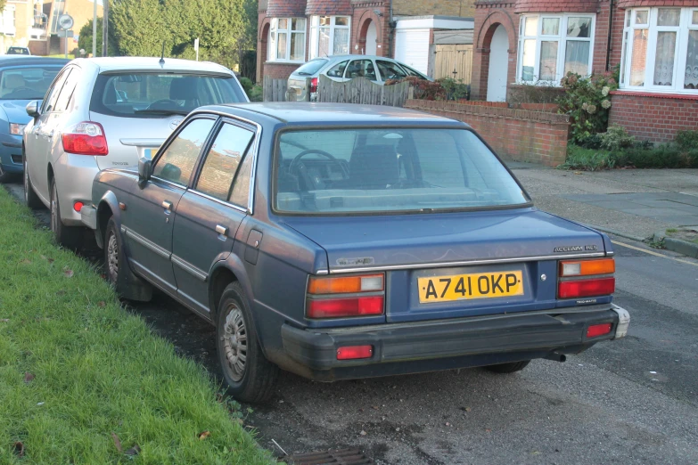 an image of two cars parked on the side of the road