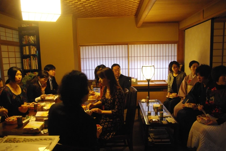 a group of people are gathered in a room