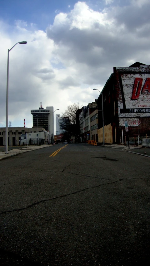 street corner in front of large buildings and parking lot