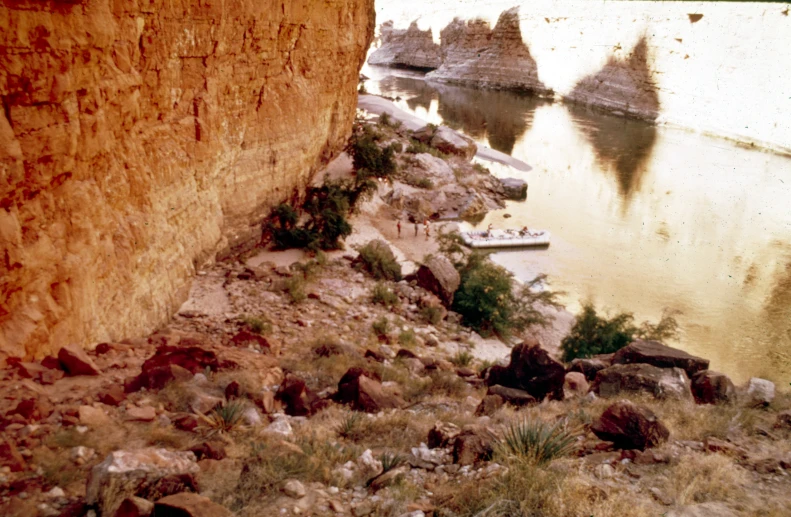 a river that is running next to some rocks