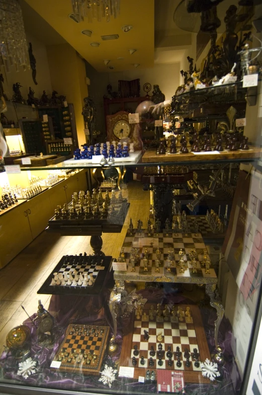 a table with lots of chess pieces on it