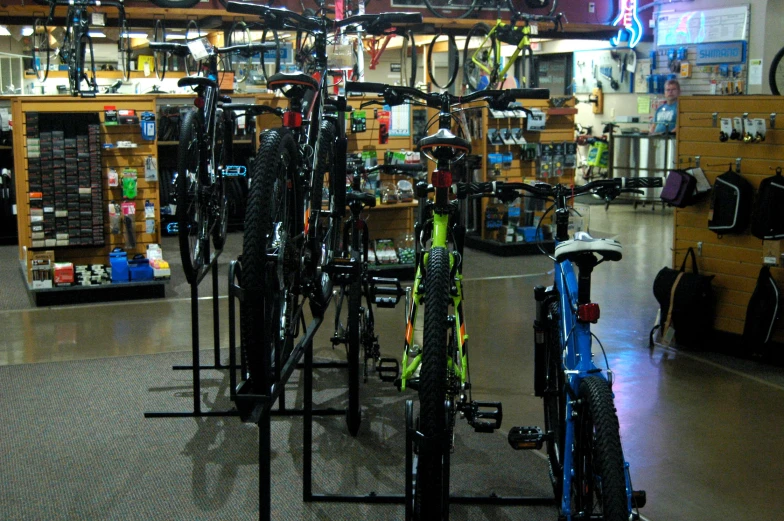 multiple bicycles are sitting in the bike shop