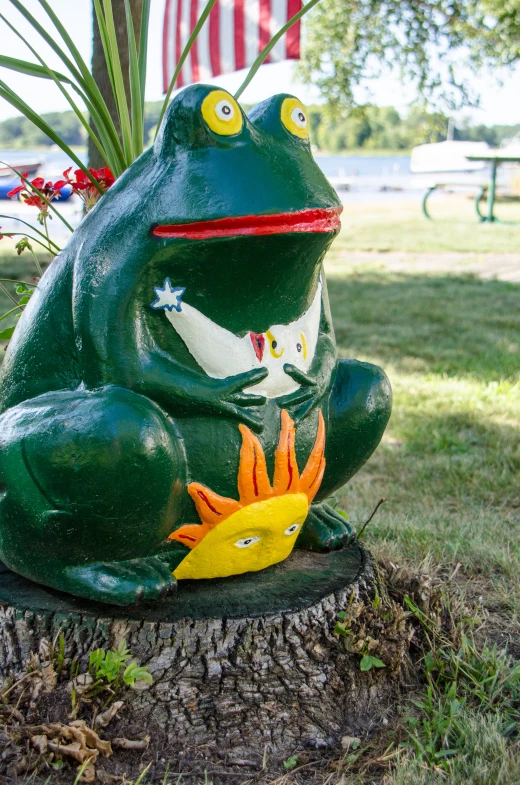 a frog statue with another frog statue next to it
