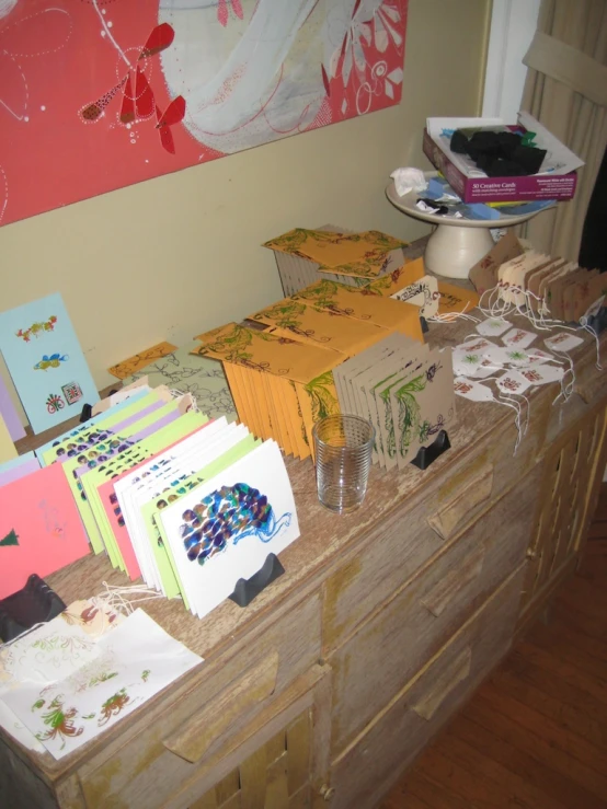 a pile of notecards sitting on top of a wooden counter