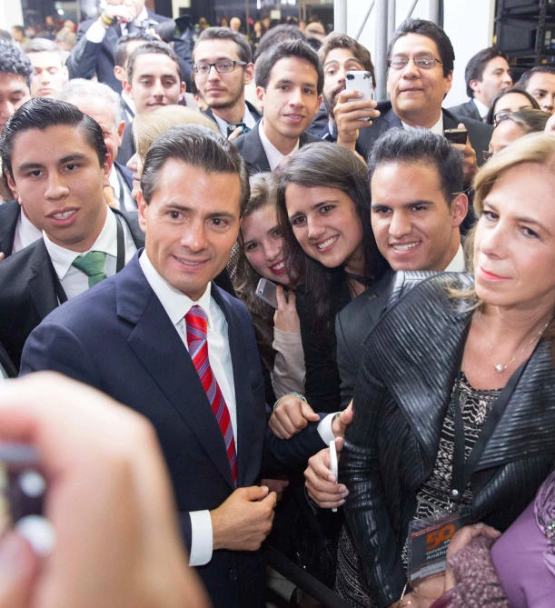 a group of people standing in front of a crowd