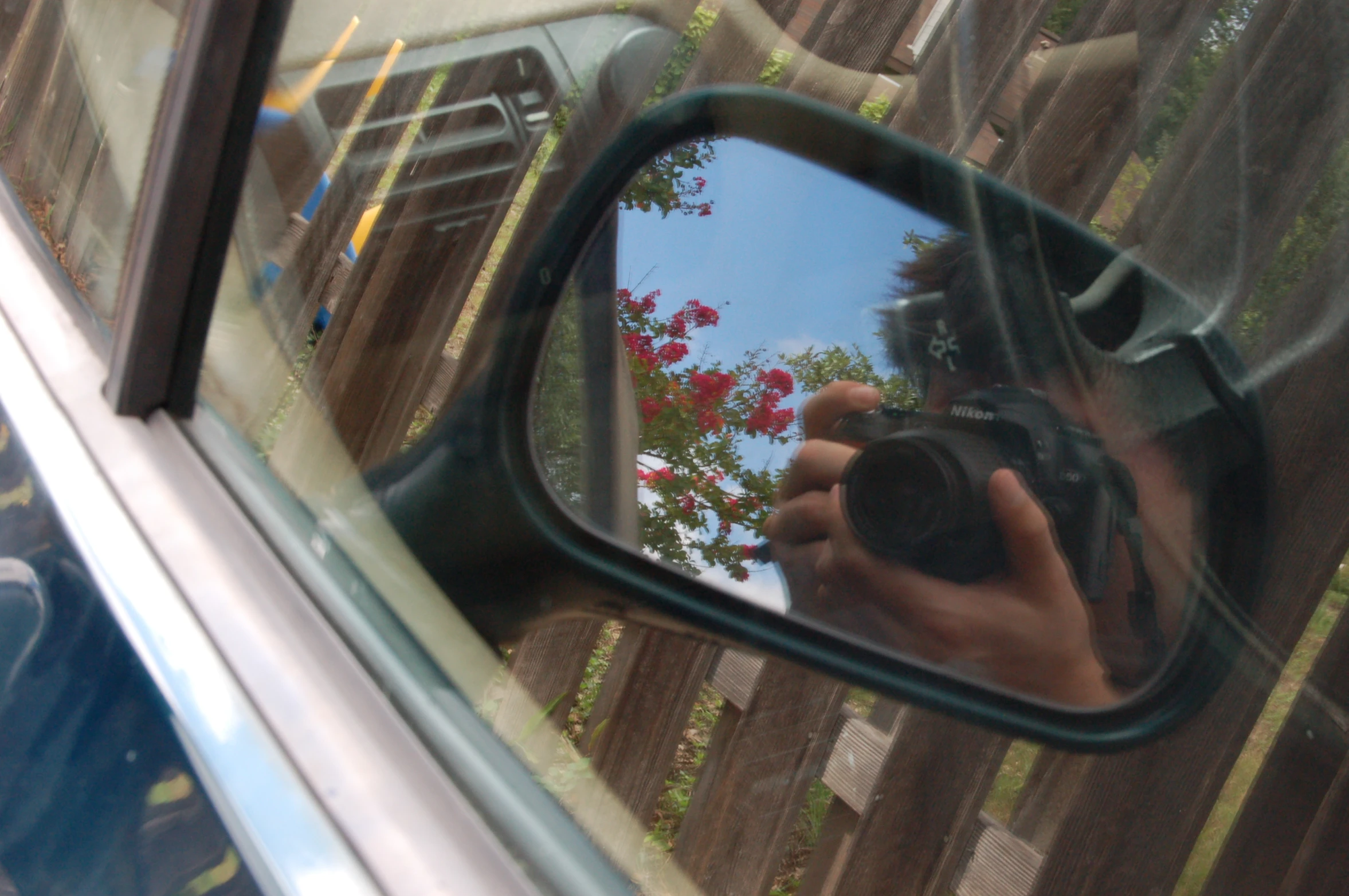 the image is taken in a side mirror of a car